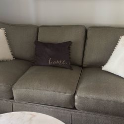 Living/family room couch, grey color.