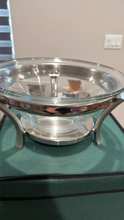 Glass salad bowl with utensils