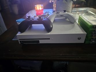 Xbox One, Two Wireless Controllers And 18 Games.