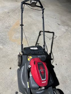 Honda lawn mower and echo weed eater.