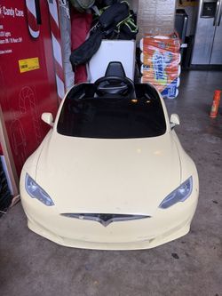Kids Tesla-style electric ride-on car