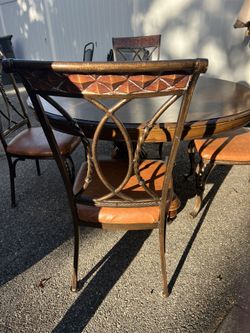 Table With 4 Cast Iron Chairs $200