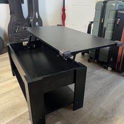 Coffee table with lifting eating surface and storage compartment