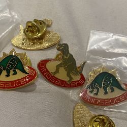 Rare collectible Vintage 1987 Dinosaucer Lapel Pin. Coca Cola Telecommunications 1987 Printed on the back. Brand new in original sealed bag. Multiples