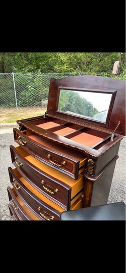 Bob’s furniture tall chest with mirror. Drawer sliding smoothly. Delivery available