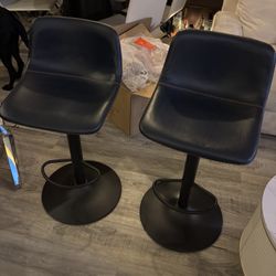 Swivel leather adjustable height bar and counter stools.