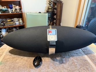 For sale is an iconic Bowers & Wilkins (B&W) Zeppelin Air wireless audio system, renowned for its room-filling, audiophile-grade sound quality and sle