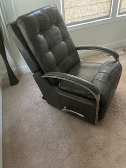 2 grey faux leather recliners
