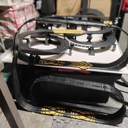 Slot car set up over 100 'feet of track 6 cars