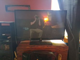 56" LG flat screen. Still works fine