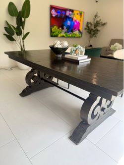 Dark wood trestle dining table