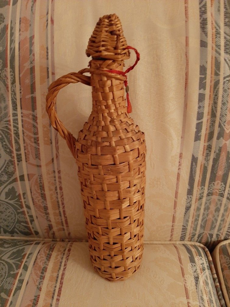 Greek wine bottle with wicker case.