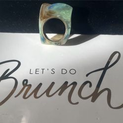 A size 6.5 blue jadeite agate ring with a gold band insert. 