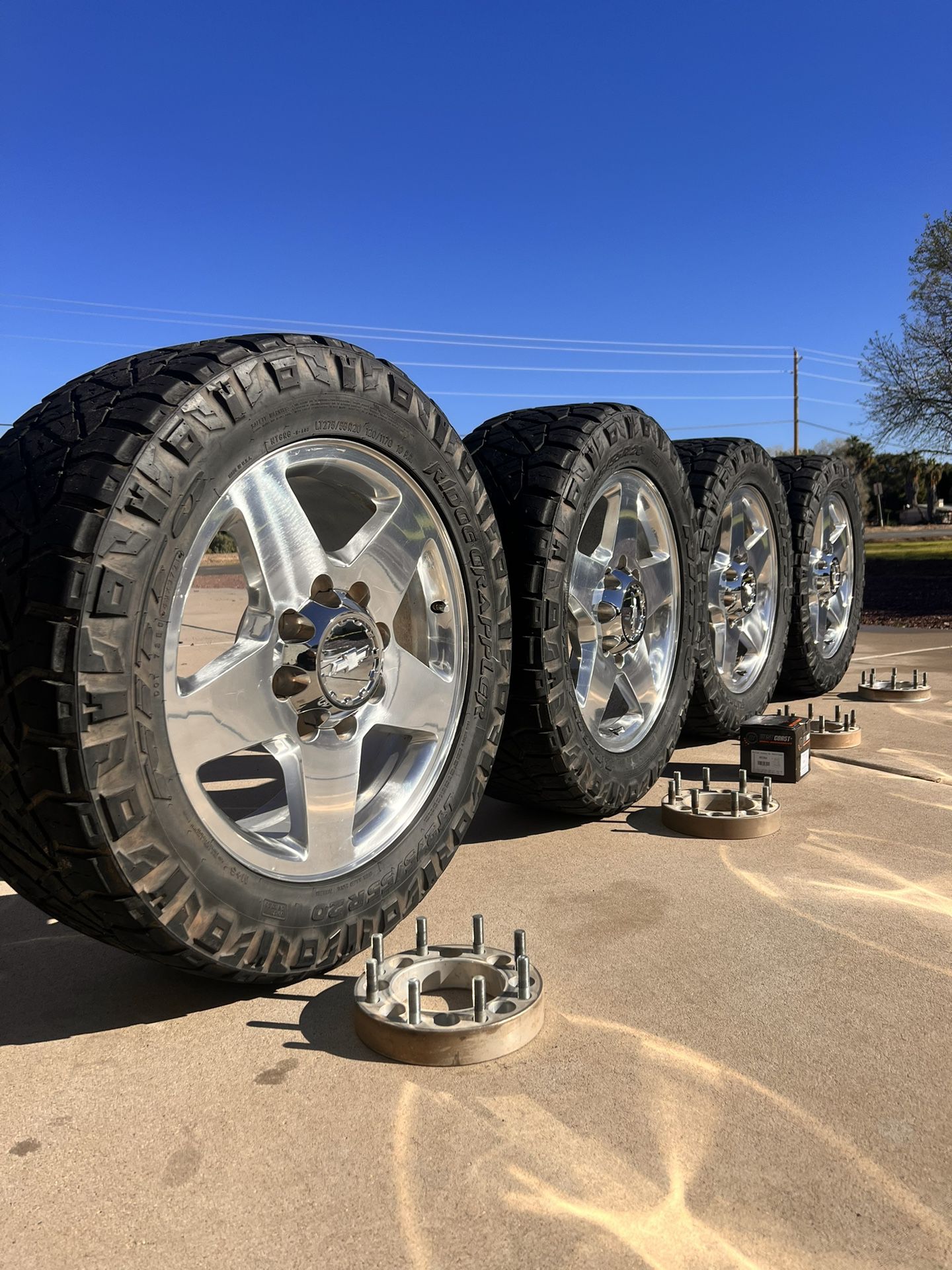 Chevy 2500HD Stock Rims With nitto tires-spacers-lugs