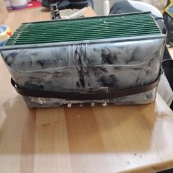 This is a vintage Magnus Chromatic Accordion, a child's toy instrument likely from the 1950s. 