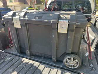 Husky toll  box with tires 50 gallons used