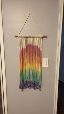 Rainbow macrame yarn wall hanging