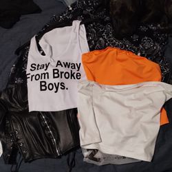 Two Halter Tops Orange And White And One Short Top With Writing On It