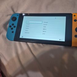 First, gin nintendo switch with dock charger and two joy cons