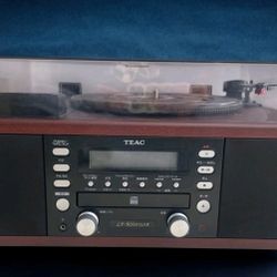 That looks like a TEAC LP-R550USB, a fantastic all-in-one system for enjoying vinyl, CDs, and radio! Want to know more about its features