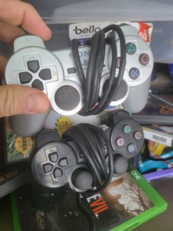 2 Sony Playstation 2 Controllers 1 Black And 1 Silver 