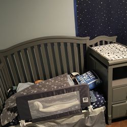 All-in-one crib with changer and storage drawers. 
