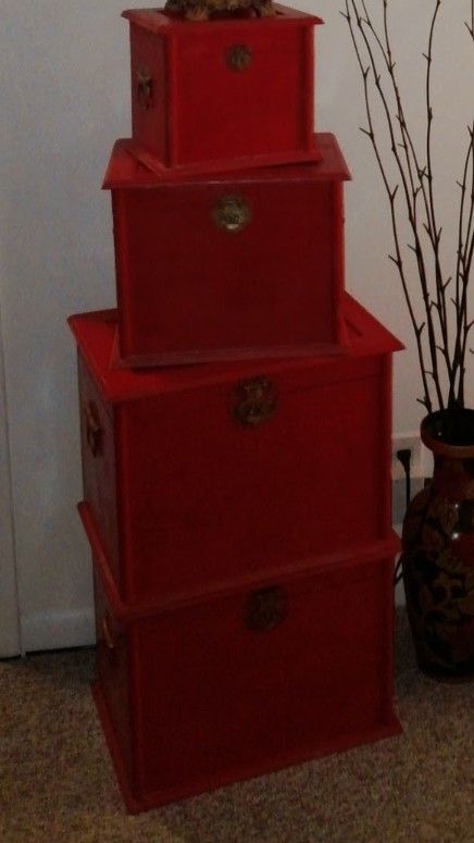 Stackable set of 4 wooden red boxes