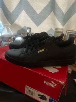 Pumas black and gold size 7 women