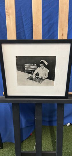 Black-And-White Portrait Of A Traditional Nurse From The Mid-Century
