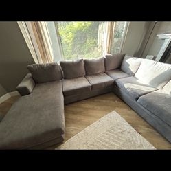 Like New Living Spaces 127 Inch Charcoal Sectional 