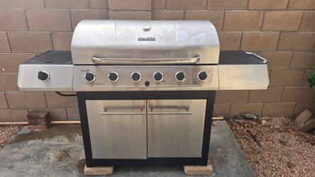 Char-Broil Stainless steel multi-burner gas grill plus a side burner with a side shelf.