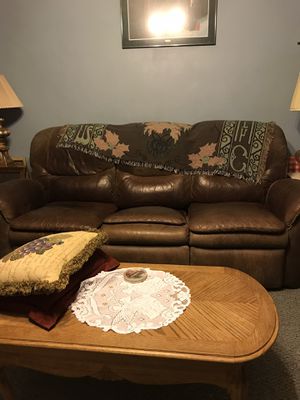 Photo Italian leather couch worn but has good life left in it the two ends of the couch to recliner matching recliner chair