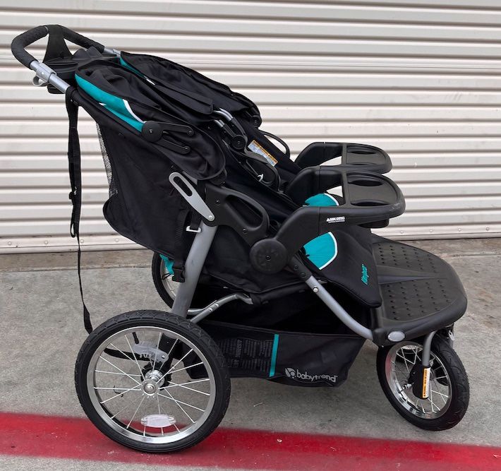 Baby Trend Navigator Double Jogger Stroller, Tropic -New open box -Some  scuffs due to poor packaging -No Other issues -not used at all. Brand Baby  for Sale in Carlsbad, CA - OfferUp