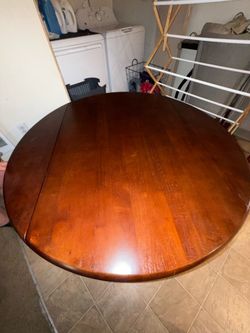 Round Wood Dining Table with 2 Gray Chairs
