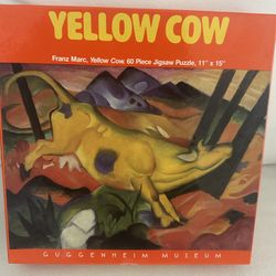 60-piece jigsaw puzzle featuring the painting Yellow Cow (1911) by artist Franz Marc.  Produced in association with the Solomon R. Guggenheim Museum O