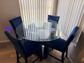 Round Glass Dining Table with 4 Blue Chairs