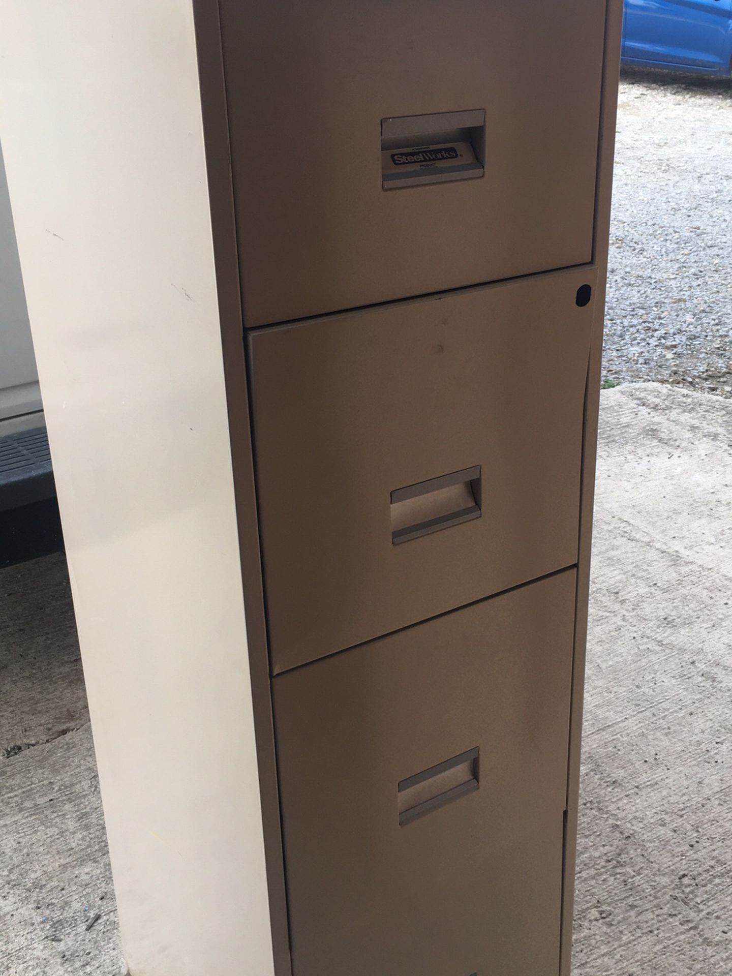 Tall tan metal file cabinet