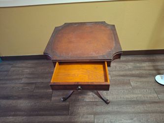 vintage mahogany accent or game table with a leather-inset top