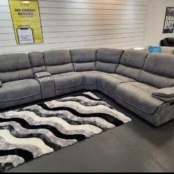 Summer clearance sale. Alejandra Gray reclining sectional only $1499. Easy finance option. Same-day delivery