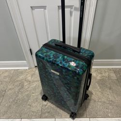 Vicente Canuto Suitcase