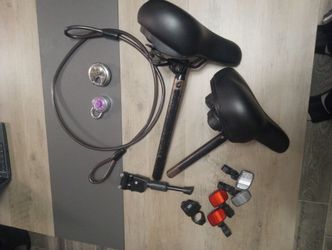 2 bicycle seats 2 locks 6ft cable 4 reflectors flashlight mount & kickstand