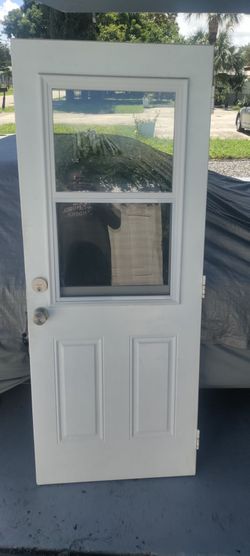 Exterior metal door with single hung non-impact window great condition approximately 32x79