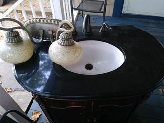 Antique sink with antique light fixture