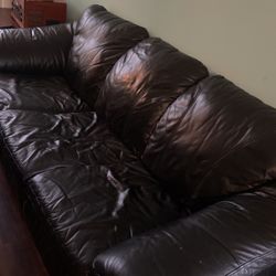 Black nice quality leather couch with leg rest