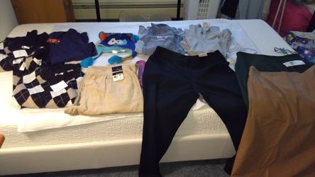 A lots new clothes and a new squeeze hat with tag