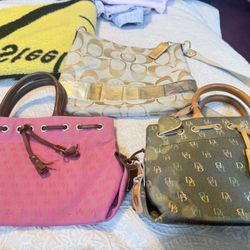 1 Coach crossbody and 2 Dooney and Bourke purses
