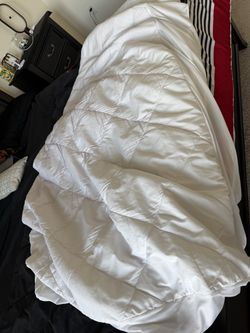 Full size bed protector white color.