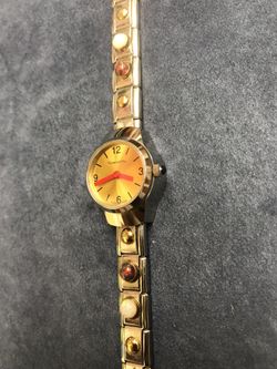 Nomination watch with gold and opal gemstones