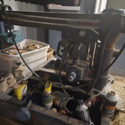 It's a craftman arm saw with cabinet