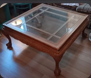 Wooden coffee table with glass
